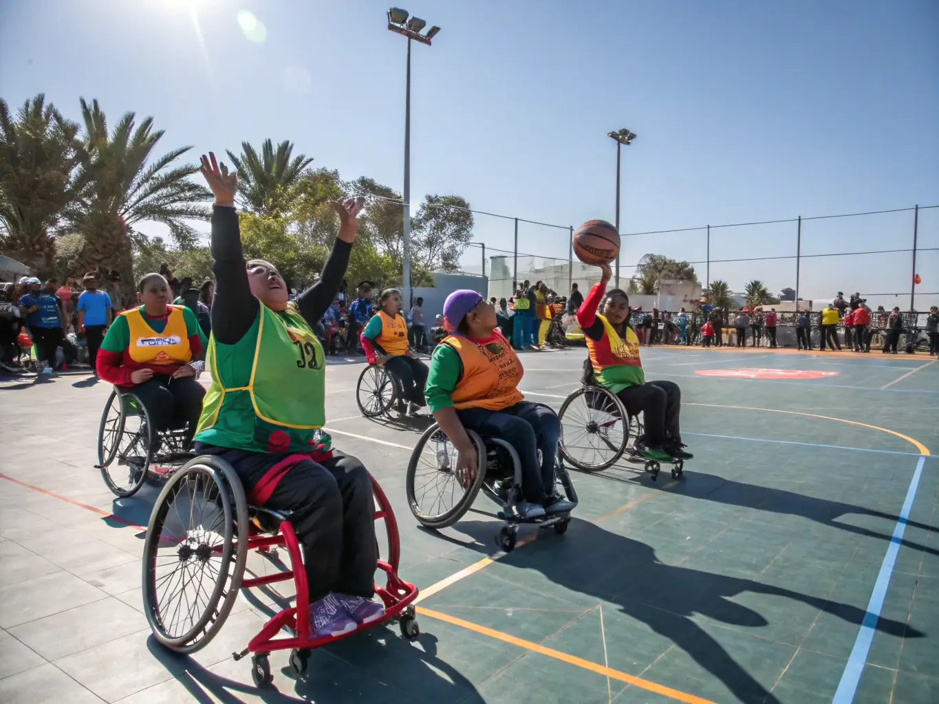 A photograph showing a diverse group of individuals with disabilities participating in a community leisure activity, such as a sports game or a cultural event.